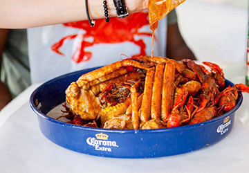 Staff member preparing seafood